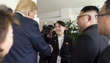 Kim Yo-jong, sister of North Korean leader Kim Jong-un, center, smiles as she shakes hands with U.S. President Donald Trump at the Capella Hotel during the North Korea–U.S. summit in Singapore on June 12, 2018. [YONHAP]