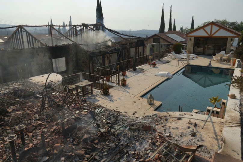 Burned houses are seen in Souni village, Cyprus, on 24 July, 2025.