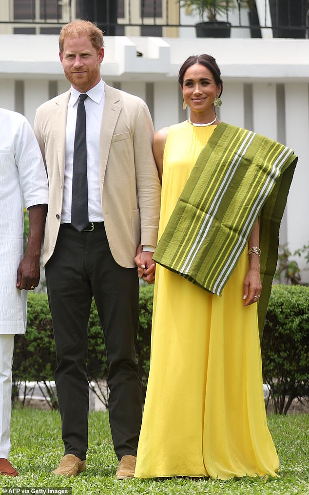 Meghan Markle and Prince Harry pose for a photo at the State Governor House in Lagos on May 12, 2024 as they visit Nigeria