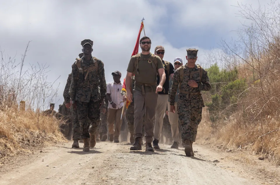 U.S. Marines with Headquarters and Support Battalion, Marine Corps Base Camp Pendleton, conduct a hike with the Vice President of the United States, the Honorable JD Vance, at MCB Camp Pendleton, California, July 11, 2025. Vance, a former Marine, led the hike to reinforce the values of camaraderie and unit cohesion. A fundamental element in Marine training, hiking builds both physical endurance and mental resilience in preparation for future battles. (U.S. Marine Corps photo by Sgt. Edgar Rafael)
