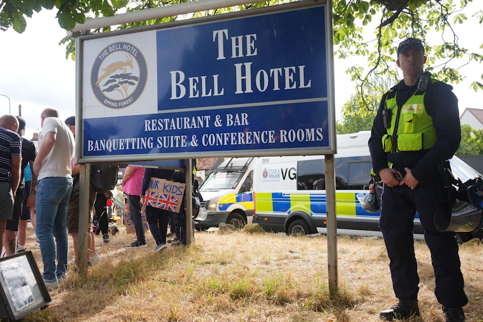 Police outside the Bell Hotel in Epping, Essex during a protest. There have been a number of demonstrations outside the hotel, believed to be housing asylum seekers, since police charged 38-year-old asylum seeker Hadush Gerberslasie Kebatu with sexual assault following an incident where he is alleged to have attempted to kiss a 14-year-old girl. Picture date: Sunday July 20, 2025.