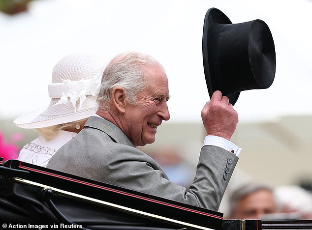 Cheers! The King waved his hat as he passed the excited crowd at Royal Ascot this afternoon