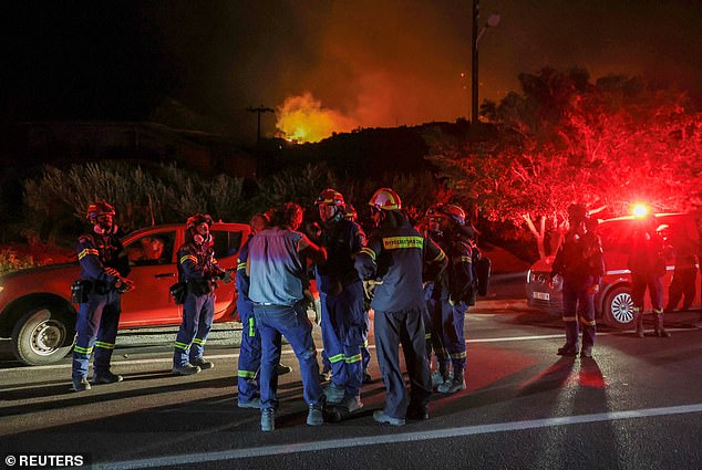 Firefighters prepare to deploy to a wildfire burning near Ierapetra, on the island of Crete, Greece, July 2, 2025