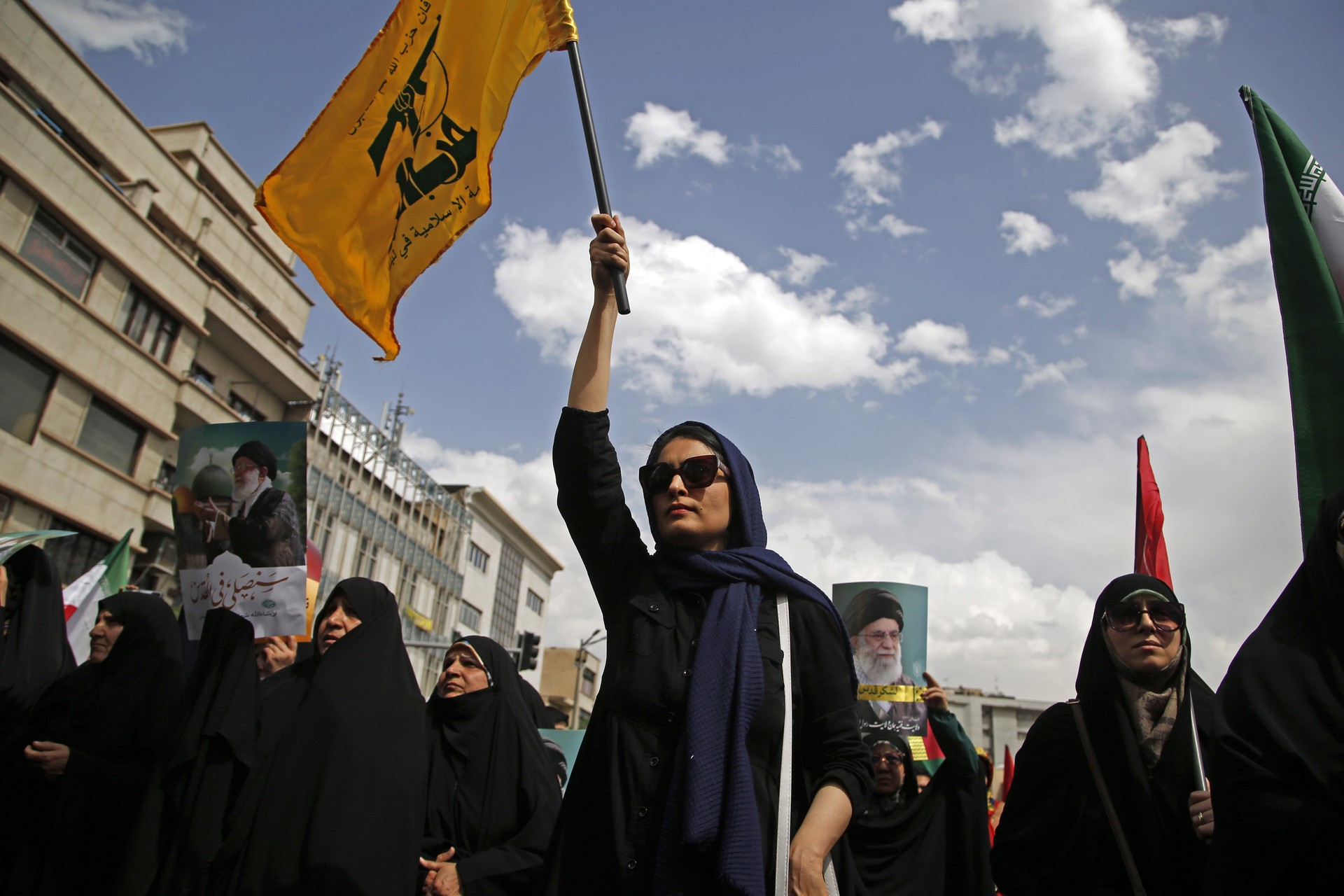 Protesters wave Hezbollah and Iranian flags at Tehran University campus in Tehran, Iran on April 11, 2025, to condemn Israel's ongoing assault on Gaza. (AA Photo)