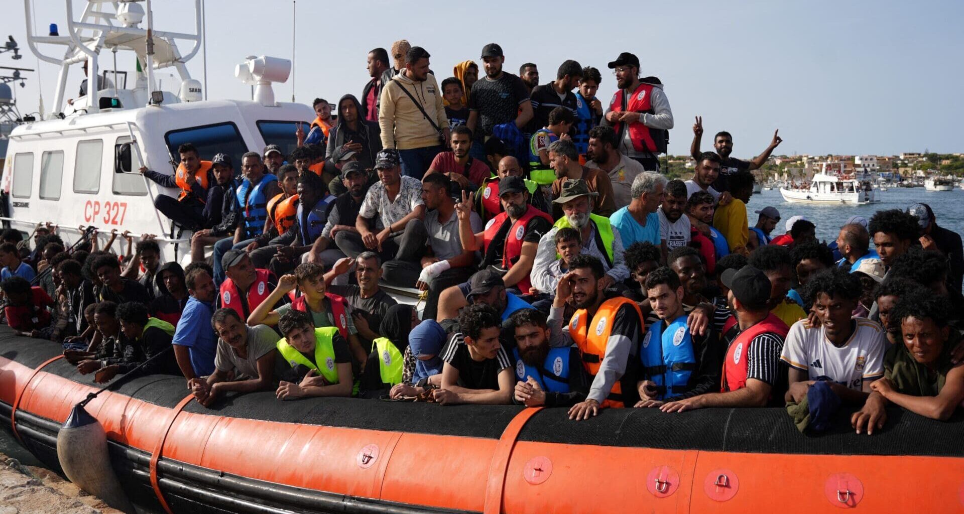 Migrants arrive in the harbour of Italian island of Lampedusa, on 18 September 2023