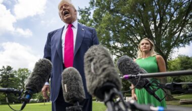 US President Donald Trump, alongside White House Press Secretary Karoline Leavitt, speaks to reporters on his way to board Marine One on the South Lawn of the White House on July 15, 2025, in Washington, DC.