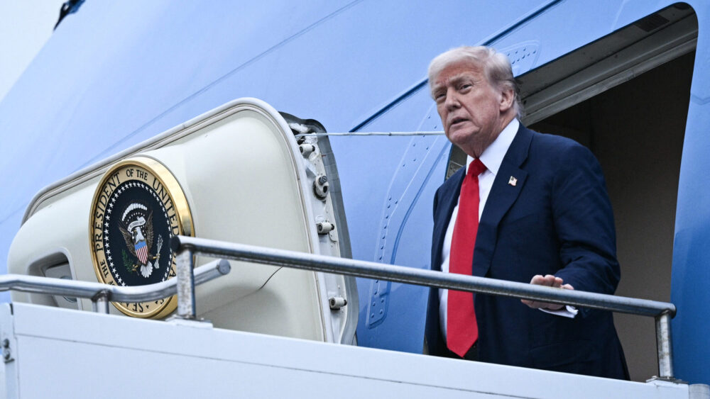 U.S. president Donald Trump disembarks from Air Force One upon his arrival at Prestwick Airport, south of Glasgow on July 25, 2025