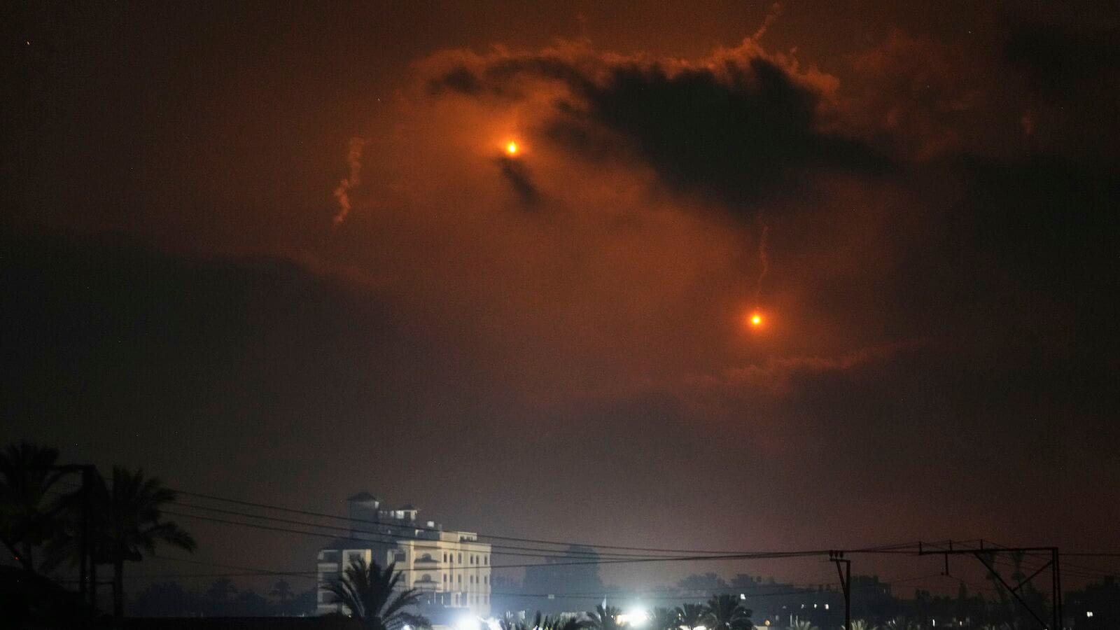 Illumination flares launched by the Israeli army are seen over Deir al-Balah in central Gaza Strip Monday, July 21, 2025. (Image: AP/PTI)