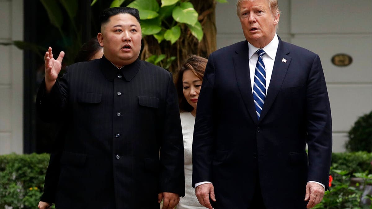  In this Feb. 28, 2019, file photo, U.S. President Donald Trump and North Korean leader Kim Jong Un take a walk after their first meeting at the Sofitel Legend Metropole Hanoi hotel, in Hanoi, Vietnam.
