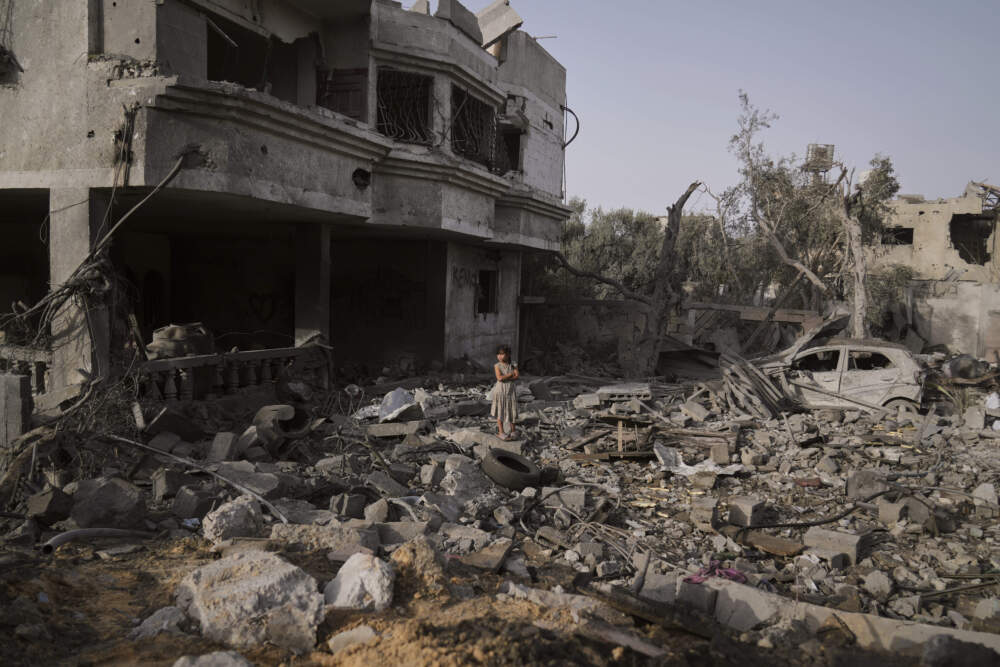 A Palestinian girl stands atop the rubble of the Al-Aimawi family's home that was destroyed by Israeli airstrikes in Al-Zawaideh, Gaza Strip, Tuesday, July 1, 2025. (Abdel Kareem Hana/AP)