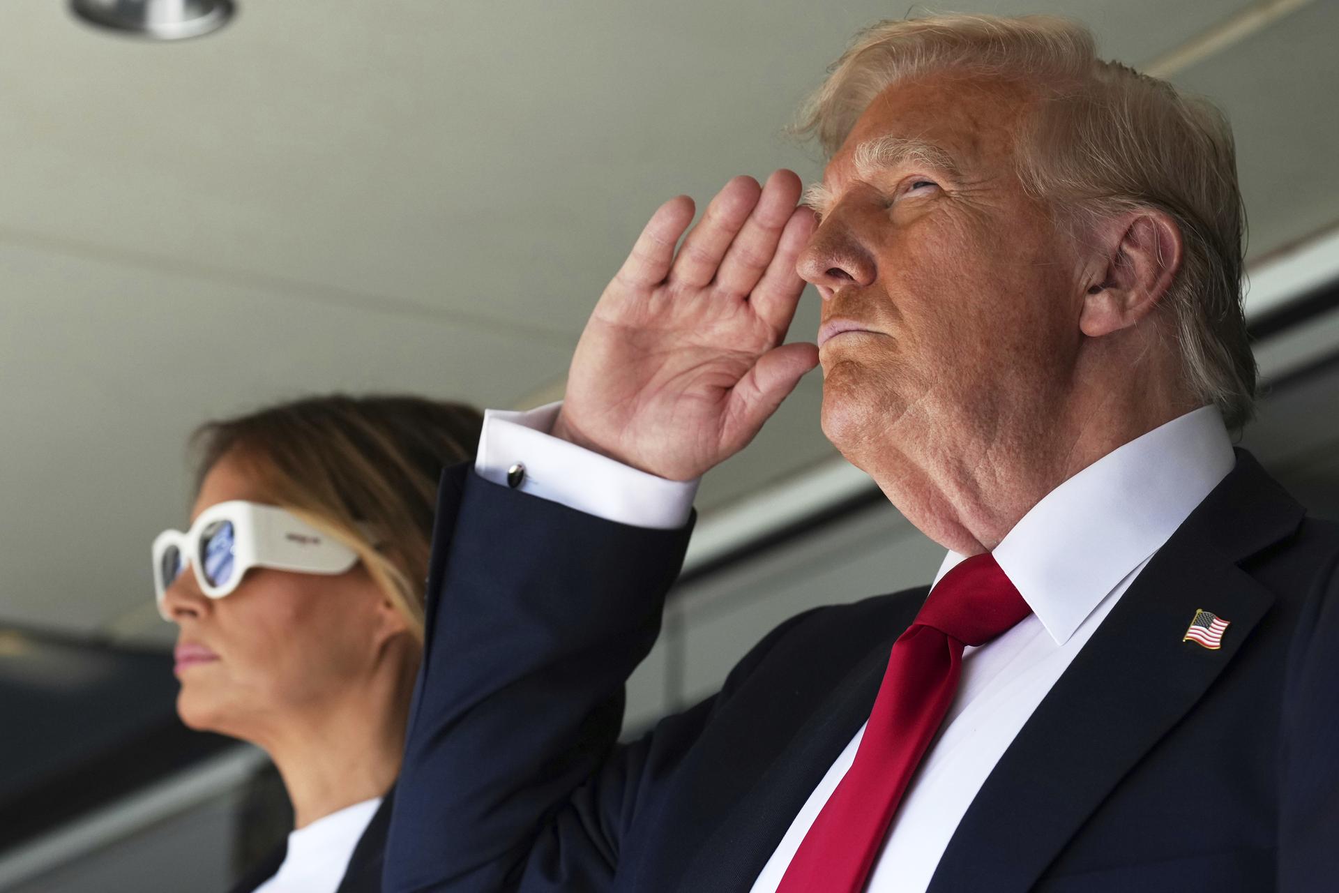 President Donald Trump salutes alongside first lady Melania Trump as they attend the Club World Cup final soccer match, at MetLife Stadium in East Rutherford, N.J., Sunday. President Donald Trump salutes alongside first lady Melania Trump as they attend the Club World Cup final soccer match, at MetLife Stadium in East Rutherford, N.J., Sunday.