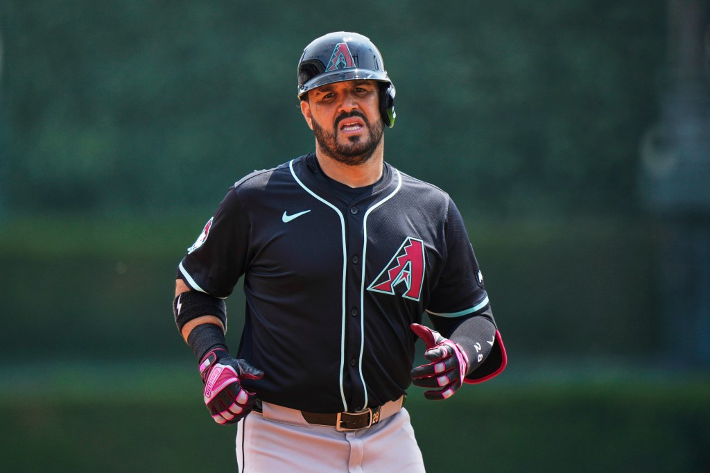 Arizona Diamondbacks designated hitter Eugenio Suarez runs back to the dugout after flying out to Detroit Tigers right fielder Kerry Carpenter during the second inning of a baseball game, Wednesday, July 30, 2025, in Detroit.