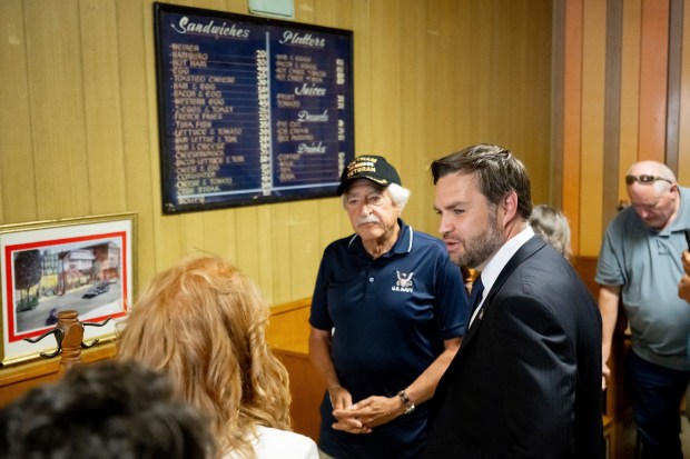 Vice President JD Vance greets patrons during a surprise stop...
