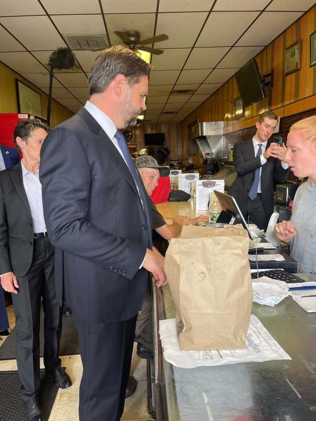 Vice President JD Vance places his order Wednesday during a...
