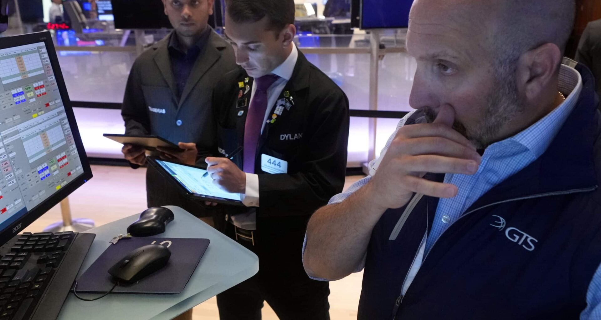 Traders work on the floor of the New York Stock Exchange