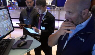 Traders work on the floor of the New York Stock Exchange