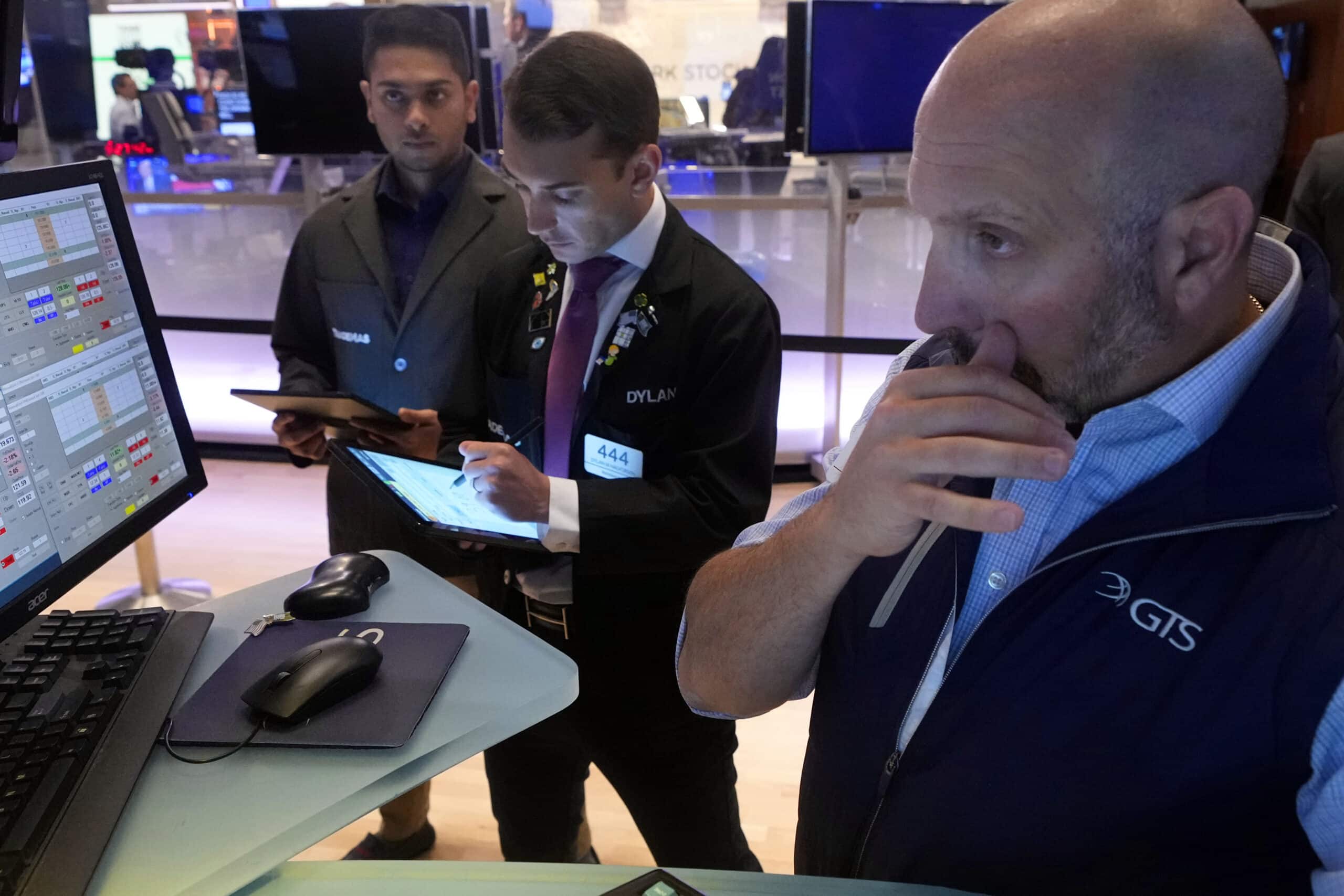 Traders work on the floor of the New York Stock Exchange