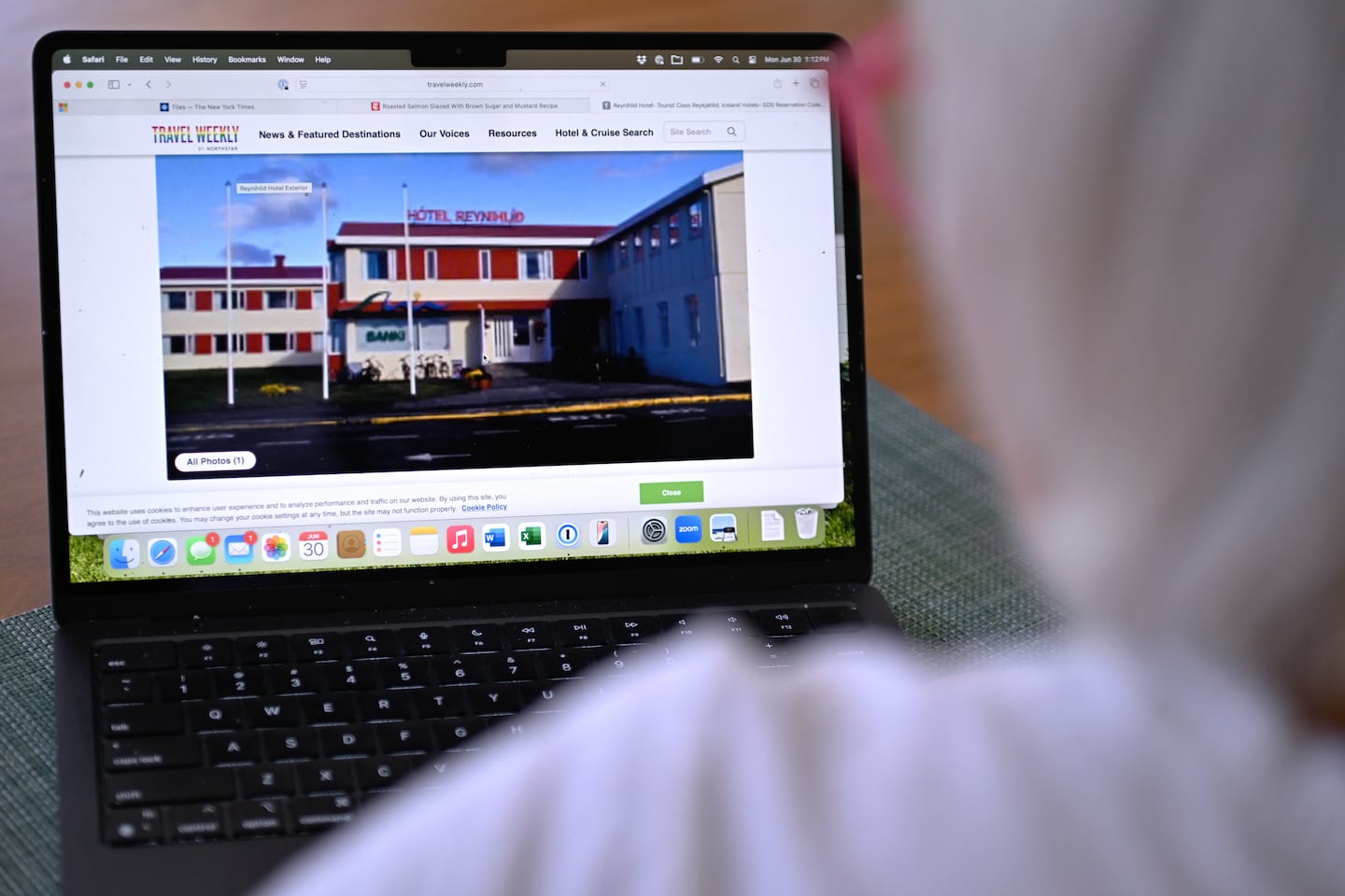 Nancy Rhoads displays a photo of the Reynihlid Hotel, where she booked a reservation through the Capital One Travel site only to discover once in Iceland that the it did not exist. Capital One did not reimburse the couple until contacted by the Globe.