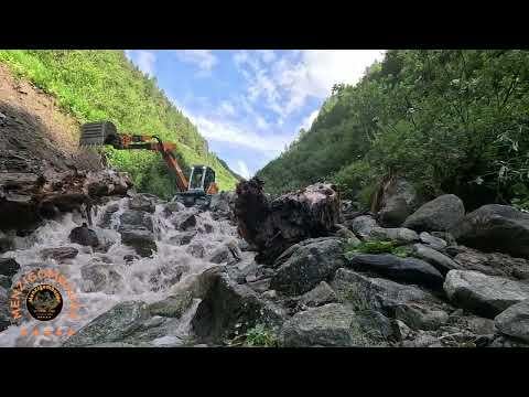 Schreitbagger   Menzi Muck Challenge mit fluss