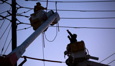 Utility workers repair a power line on Feb. 10, 2022, in Ridgefield N.J. Credit: EMAZ/VIEWpress via Getty Images