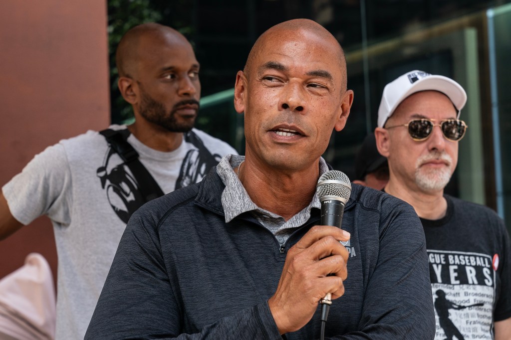 Executive Director NFL (National Football League) players Association Lloyd Howell speaks as striking members of Writers Guild of America picketing in front of CBS Broadcast Center on theme Sport Writers Picket. Executives from NHL Players Association, NFL Players Association, MLB Players Association joined and spoke during picket. 