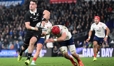 Will Jordan of New Zealand makes a pass as a France player attempts a tackle during the first July 2025 Test