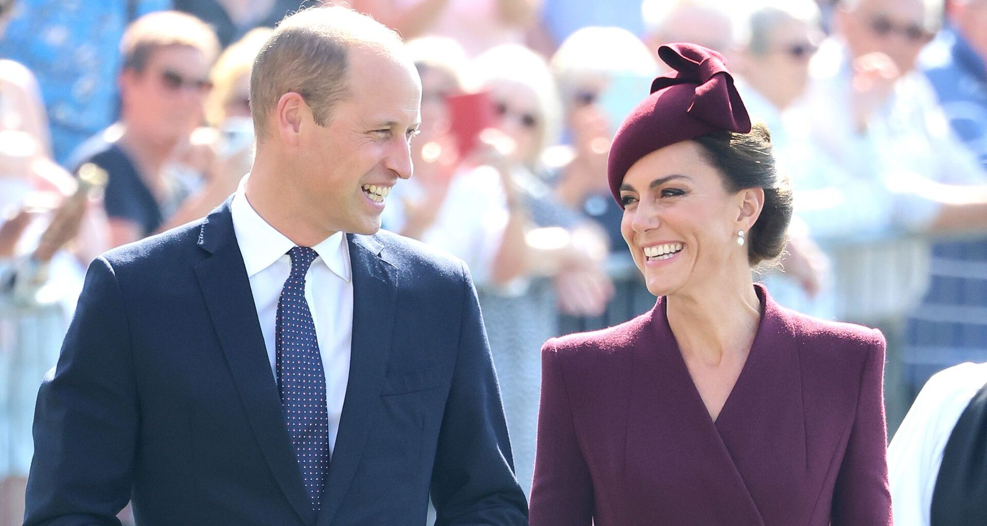 Prince William and Kate Middleton smiling at one another