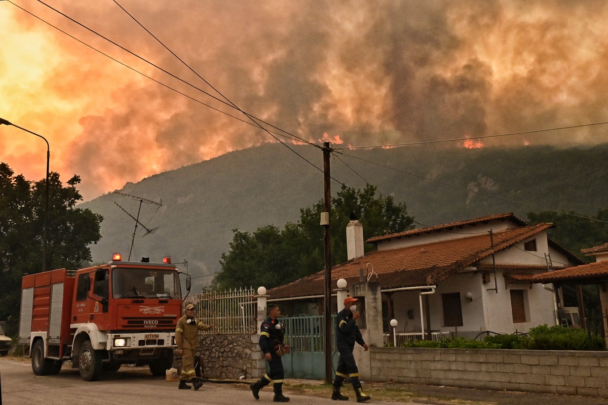 A major forest fire in Greece forces several villages to evacuate