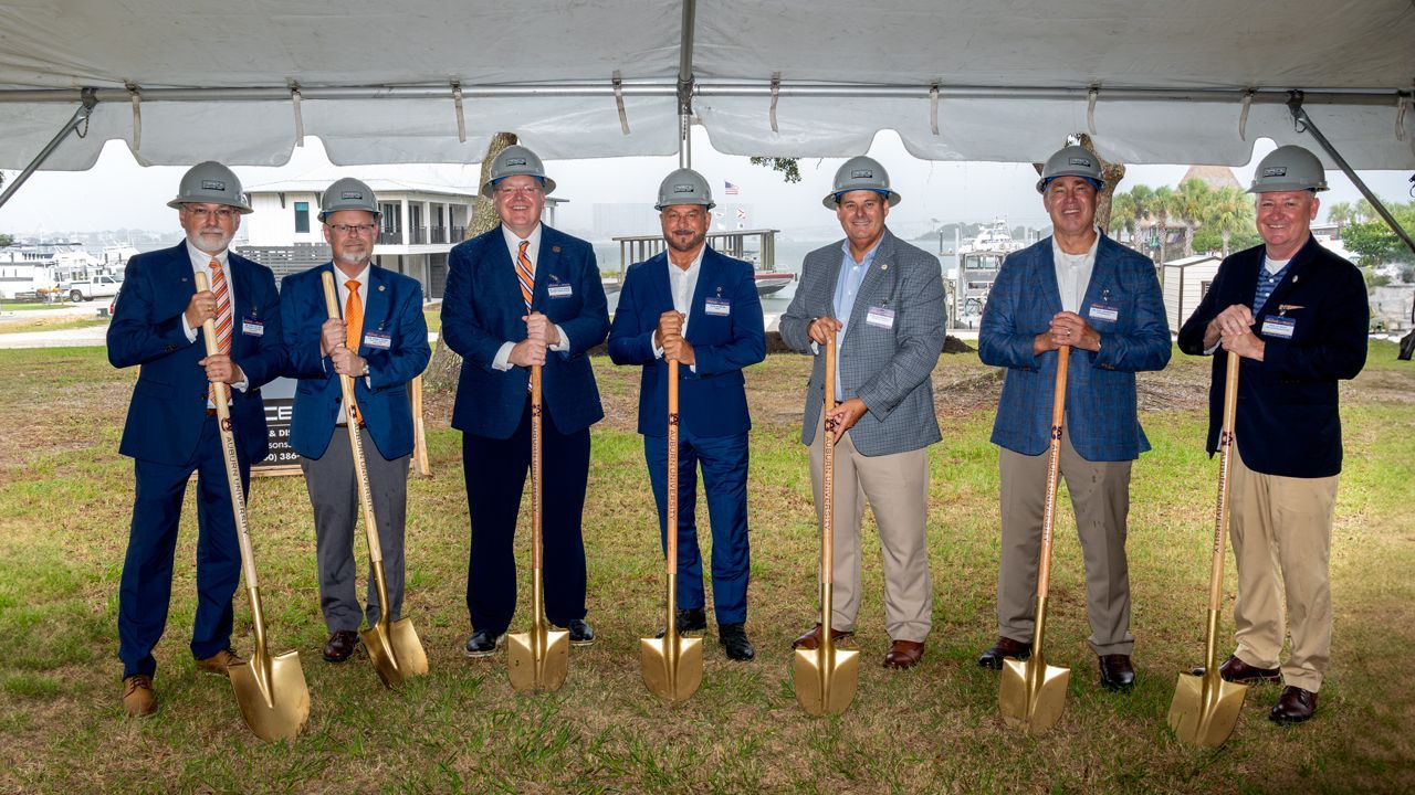 Auburn University administrators and Orange Beach city leaders break ground on the Auburn University Gulf Coast Engineering Research Station at Terry Cove in Orange Beach in July 2025.