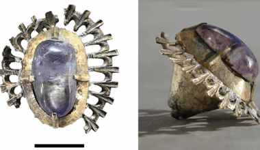 An amethyst is set in silver that fans out like rays