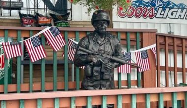 Stolen 'Handsome Gene' statue returned to Stanchfield business, 1 suspect in custody