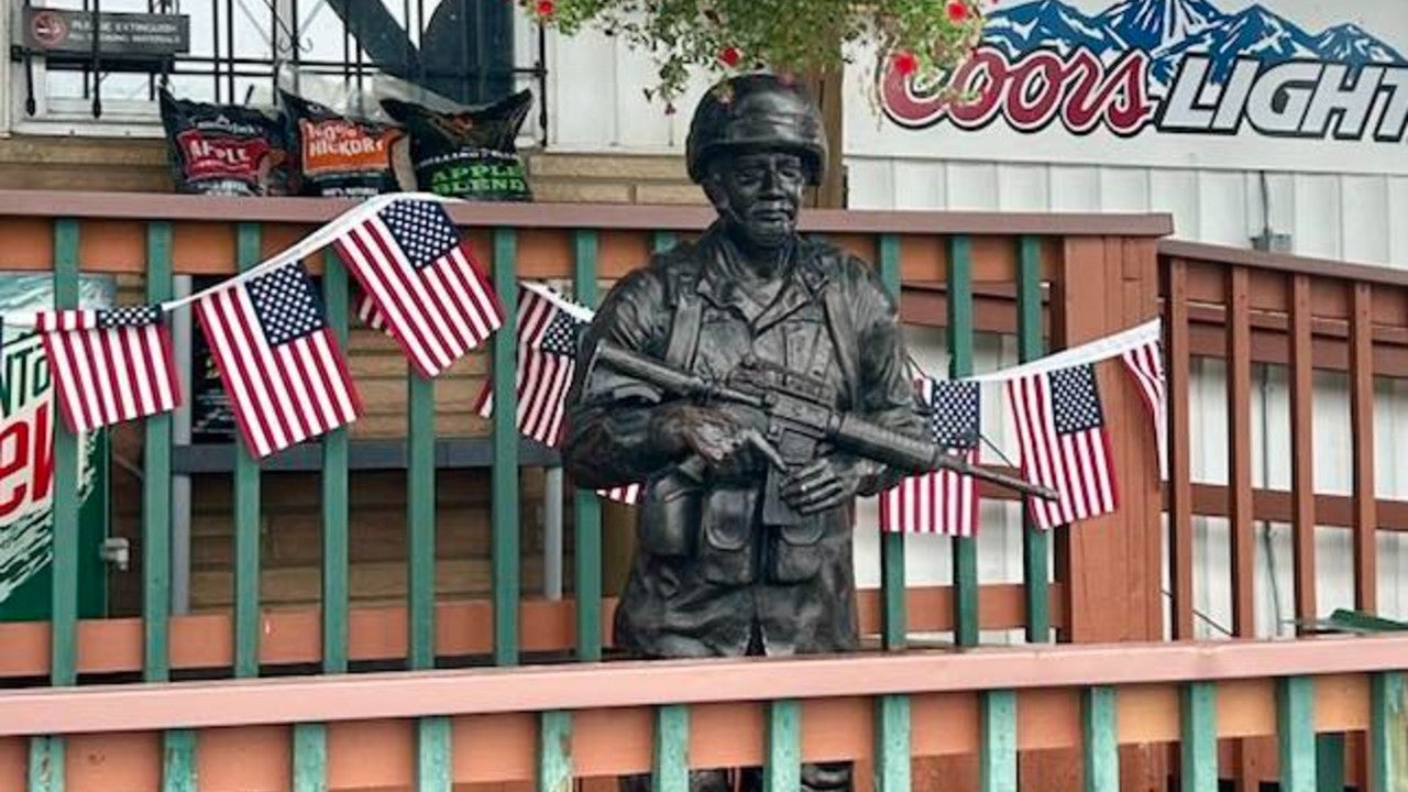 Stolen 'Handsome Gene' statue returned to Stanchfield business, 1 suspect in custody