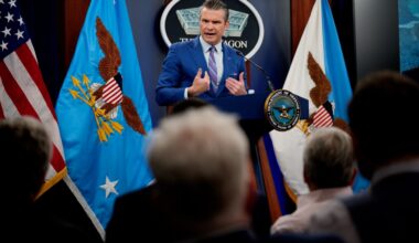 U.S. Defense Secretary Pete Hegseth speaks at a podium during a news conference.