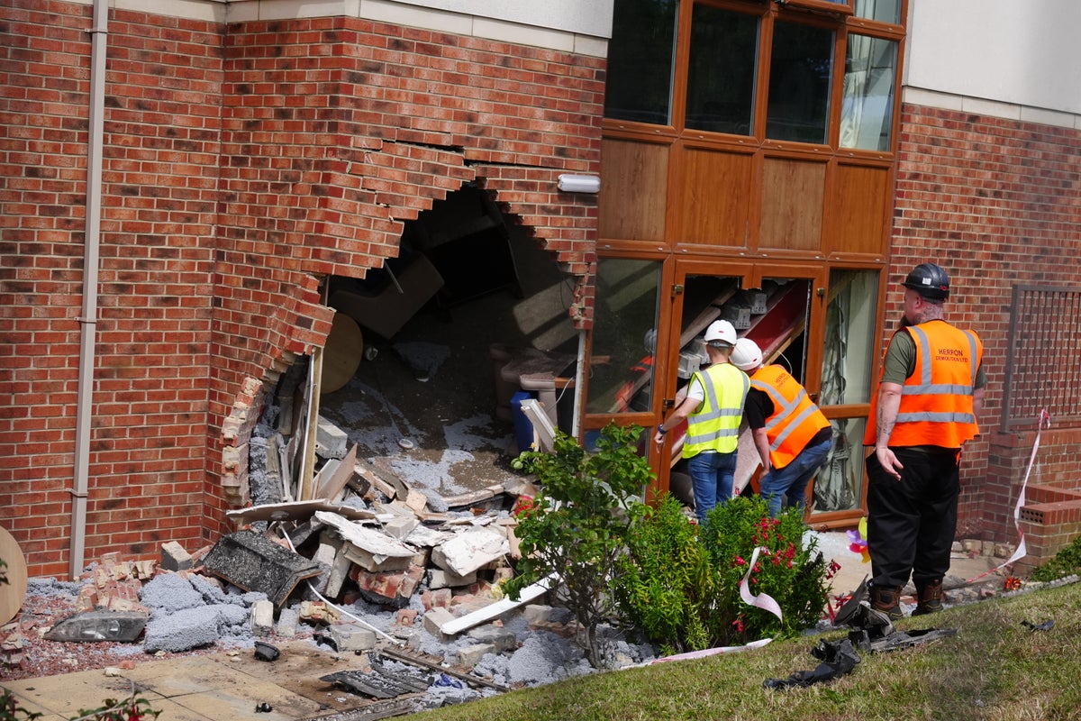 Two pensioners die after car crashes into care home