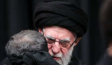 This handout picture released by the office of Iran's Supreme Leader Ayatollah Ali Khamenei on July 5, 2025 shows him embracing a mourner during a mourning ceremony in Tehran marking the ninth day of the Islamic month of Muharram in the lead-up to Ashura, a 10-day period commemorating the seventh century killing of Prophet Mohammed's grandson Imam Hussein. (Photo by LEADER OFFICE / AFP)