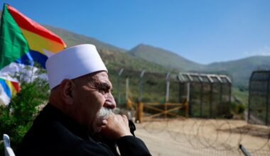 Israeli Druze man waits to greet Syrian Druze who cross the border from Syria into the Israeli-occupied Golan Heights, as they come to the annual gathering at the Nabi Shuayb Shrine, a holy place for the Druze community, at Majdal Shams, April 25, 2025. REUTERS/Ammar Awad