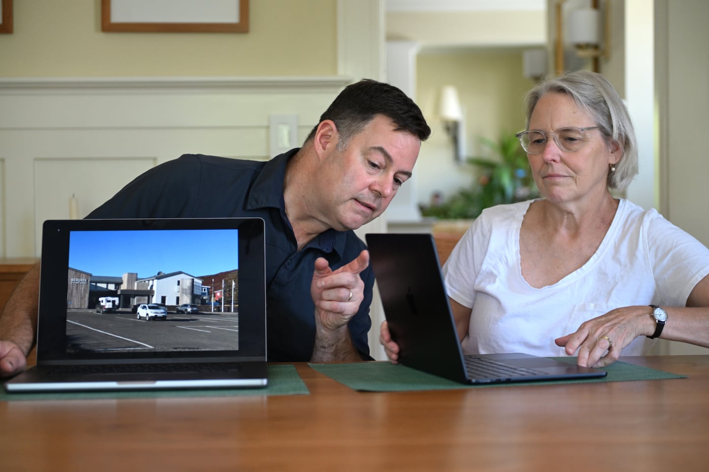 Adam Glick and Nancy Rhoads booked a reservation through the Capital One Travel site only to discover once in Iceland their hotel, did not exist. Glick displays a photo of the chain hotel, with a different name and address, that was on the location of the original hotel they booked on Capital One.