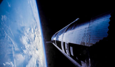 a huge cylindrical silver spacecraft flies above earth