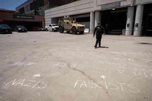 Protest messages are left outside the Metropolitan Detention Center in...