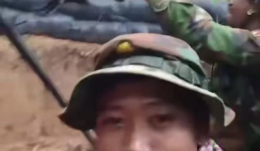 Cambodian troops firing bursts from an HMG towards Thai positions.