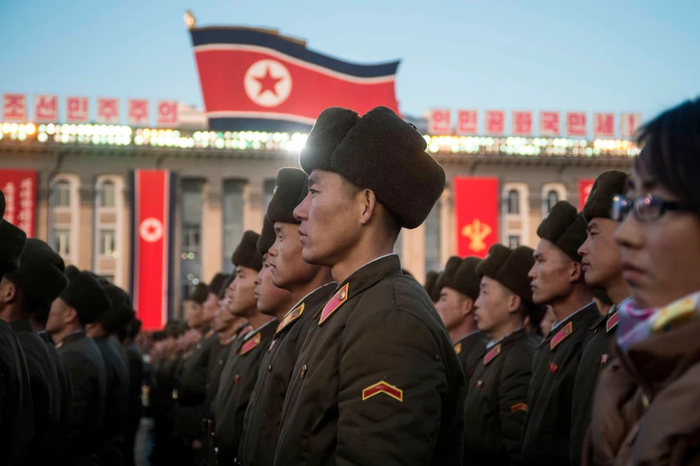 North Korean soldiers attend a mass rally to celebrate the declaration that it had achieved full nuclear statehood in Pyongyang