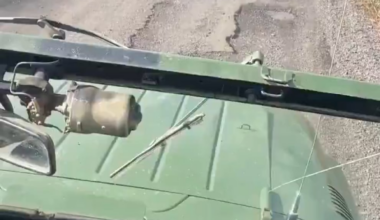 Russian invaders pass by their fellow motorbike assault trooper who has already met with a Ukrainian drone. July 2025 [graphic content]