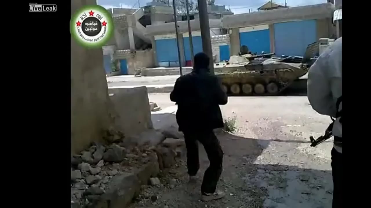 Group of Syrian rebels taking a direct hit from a Syrian Army BMP-1. Circa 2012, Syria.
