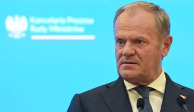 Donald Tusk looking at someone outside photo