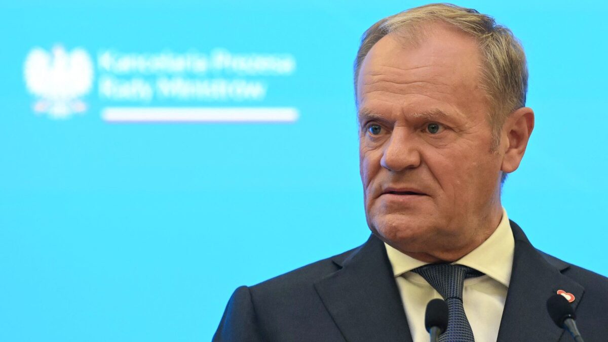 Donald Tusk looking at someone outside photo