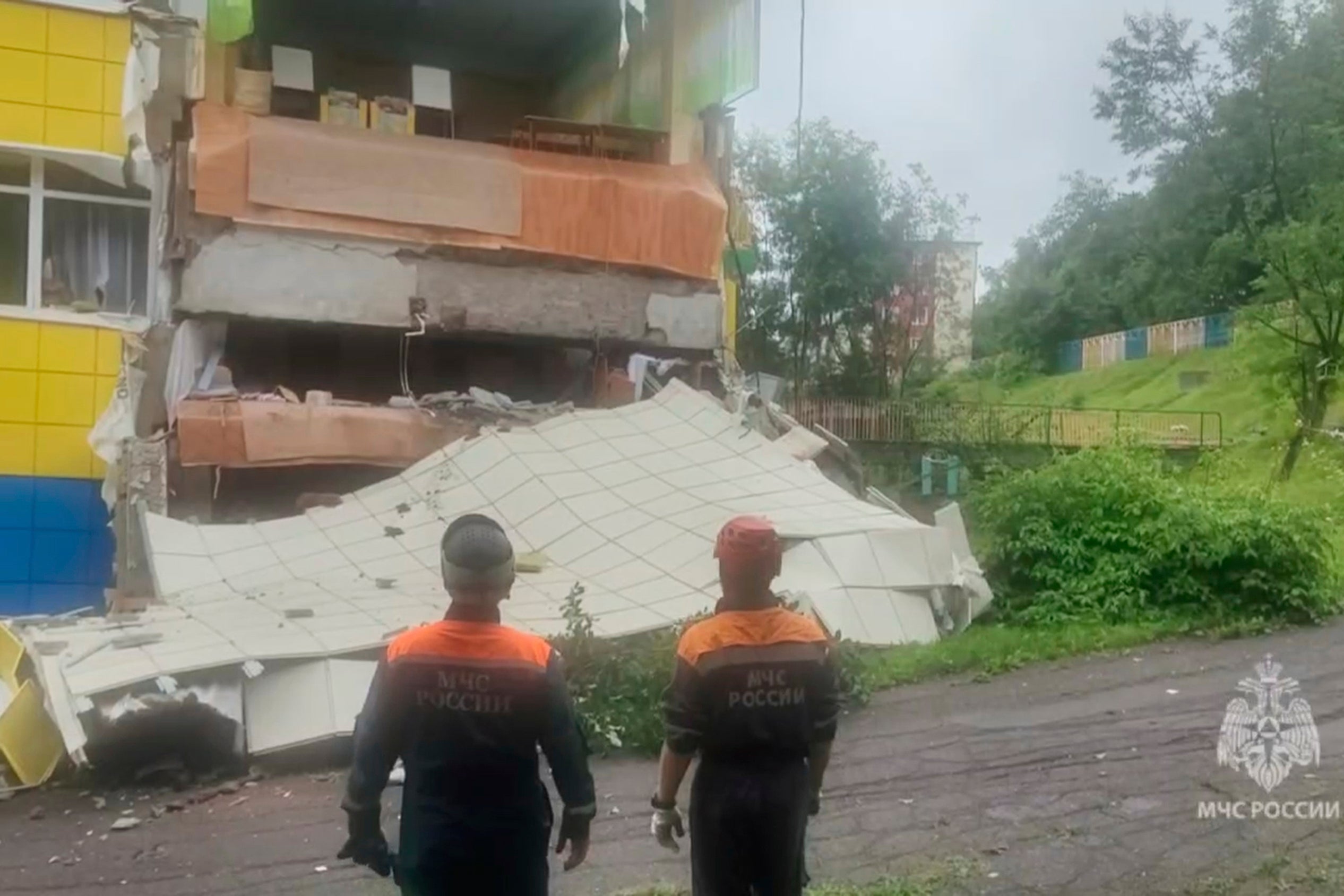 In this image taken from a video released by Russian Emergency Ministry Press Service, rescuers inspect a kindergarten damaged by an earthquake in Petropavlovsk-Kamchatsky, Russia, Wednesday, 30 July 2025