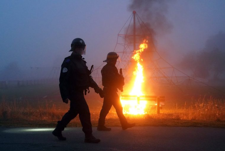 Police officers clash with people thought to be migrants in Gravelines, France, during an attempted small boat crossing to the UK. Picture date: Friday July 18, 2025. PA Photo. Photo credit should read: Gareth Fuller/PA Wire