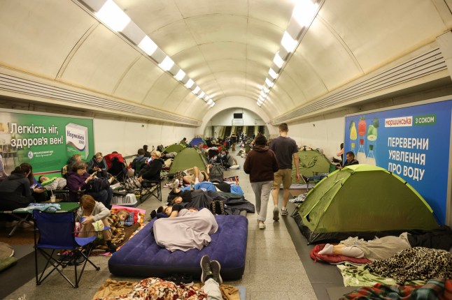 KYIV, UKRAINE - JULY 19: People take refuge in the subway, which acts as a shelter during an attack by Russian drones on July 19, 2025 in Kyiv, Ukraine. Over night the Russian army attacked Ukraine with strike drones, cruise and ballistic missiles. The following cities were hit: Pavlohrad, Odesa, Shostka, Zhytomyr, Dnipro and Poltava. Russian forces once again used the tactic of directing a large number of strike drones to weaken mobile fire groups, followed by missile strikes. (Photo by Ivan Antypenko/Suspilne Ukraine/JSC