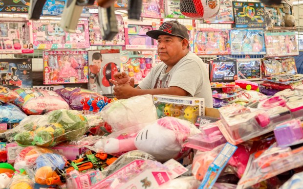 Toys vendor Miguel Lozano waits for customers at the Flea...