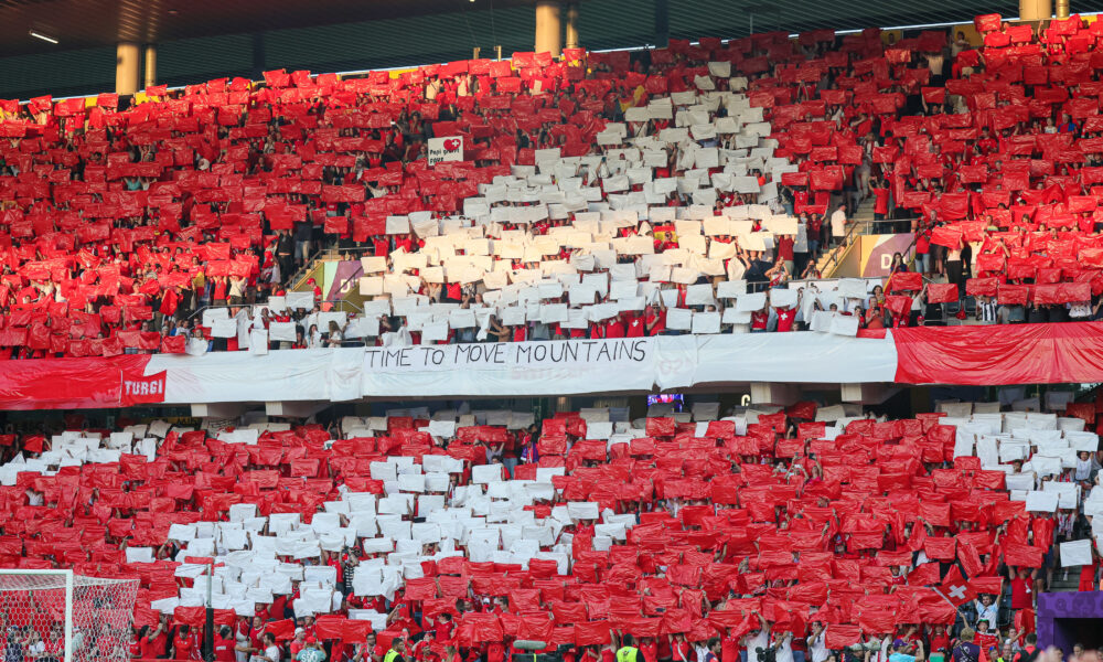 Fans create the Swiss flag in the stands at Stadion Wankdorf before the UEFA Women's Euro quarterfinal match between Spain and Switzerland on July 18, 2025.